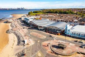 an aerial view of a city with a beach at The Promenade House in New Brighton