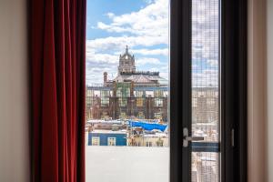 a view of a city from a window at Princes Gardens in London +35 photos