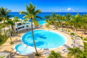 an overhead view of a swimming pool at the resort at 1 Sol Dominicus Solo Adultos Habitación con Entrada Independiente y Baño Privado in Bayahibe +12 photos