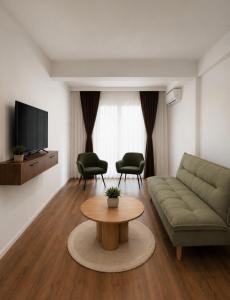 a living room with a couch and a table at Euro Hotel in Peje