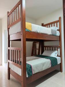 a couple of bunk beds in a room at Casa Flor in San Antonio de la Cal