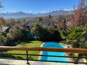 a view from the balcony of a house with a swimming pool at Casa Super Vista a los Andes in Santiago