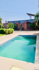 a swimming pool in front of a house at Villa à Marrakech in Oulad Sidi Cheïkh +3 photos