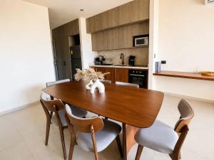 a dining room table and chairs in a kitchen at Mayan View Walk to Beach & Tulum Ruins in Tulum +24 photos