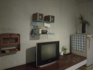 a television sitting on a table in a room at THAMONWAN hostel in Cha Am
