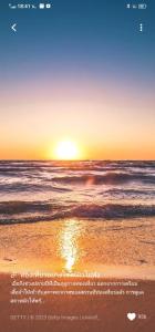a beach with the sun setting over the ocean at THAMONWAN hostel in Cha Am +18 photos
