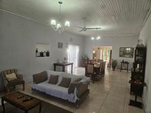 a living room with a couch and a table at El Ñangapiri in Mercedes