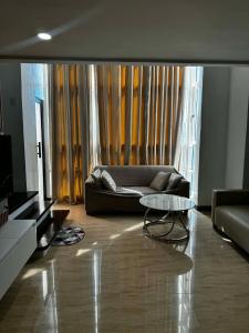 a living room with a couch and a table at Luxury Loft at Crown Regency in Cebu City +5 photos