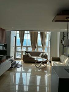 a living room with a couch and a table at Luxury Loft at Crown Regency in Cebu City