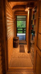 an inside view of a cabin with a door and a barrel at The DACHA escape in Viimsi
