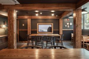 a dining room with a table and chairs at The Ozarker Lodge in Branson