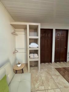 a living room with a couch and a book shelf at Apartamento Aura 10 in El Coco +16 photos