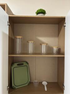 a tv sitting on a shelf in a cabinet at Apartamento Aura 10 in El Coco