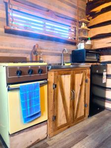 a kitchen with a stove and a sink at La rustica in Castro