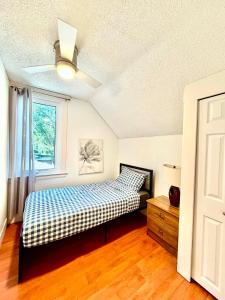 a bedroom with a bed and a window at Cozy Full House 3 bedrooms in Regina +19 photos