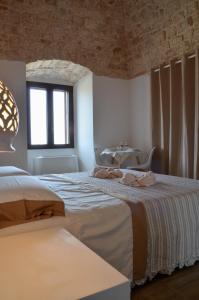 Tempat tidur dalam kamar di Masseria Poli Country House