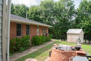 a brick house with a brick fire hydrant in the yard at National Harbor Suite 1 in Fort Washington +17 photos