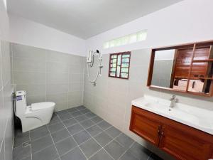 a bathroom with a toilet and a sink at Cloudy Hill Homestay and Hostel in Kampot +28 photos