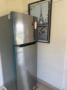 a refrigerator with a picture of the eiffel tower at DEPARTAMENTO SOL Y MAR in San Carlos