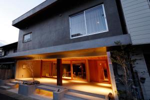 a house with a lit up patio in front of it at たゆら in Nara