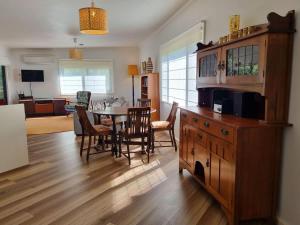 a living room with a table and a dining room at Salty Dog in Long Beach