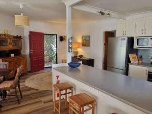 a kitchen with a counter and a table and chairs at Salty Dog in Long Beach