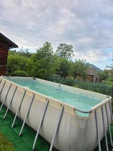 a large swimming pool with chairs around it at HIT house in Slavske