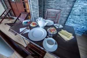 a table with plates of food on top of it at Zircon Ella in Ella