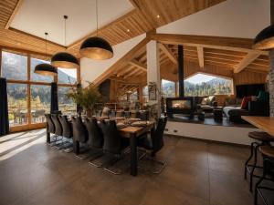 a dining room with a table and chairs at Chalet Azalée, Montriond, Morzine, Avoriaz in Montriond