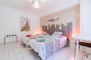 a bedroom with two beds and a sink at Julia in Aussonne +38 photos