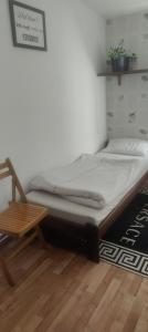 a bed sitting on the floor in a room at Karczma KOSZARKA in Ploski