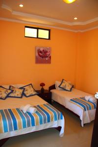 Postel nebo postele na pokoji v ubytování Hostal Duncan