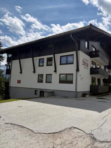 a large white building with a lot of windows at Haus Stöckl Top 14 in Königsleiten