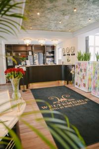 a store lobby with a black rug on the floor at Weltemühle Hotel by Miri's Dresden in Dresden