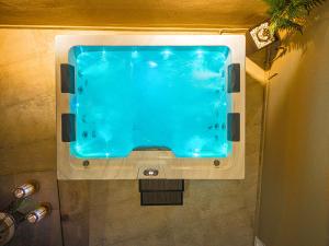 a large swimming pool in a bathroom at Holiday Sea View Villas in Katastárion