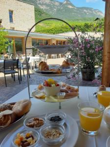 a table with a tray of breakfast food on it at Pension Hasslhof in Caldaro