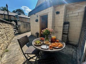 a table with food on it on a patio at Benson House Box in Box