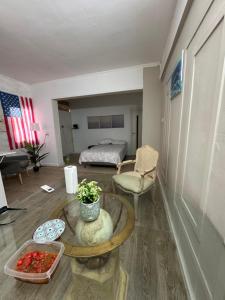 a living room with a table and a bed at Home Star 2 in Dāliyat el Karmil