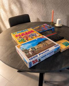 two pizza boxes sitting on top of a table at Quiet and charming studio apartment in Vejle +2 photos