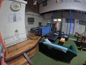 an overhead view of a living room with a couch at 1849 Backpackers at The London in Albany
