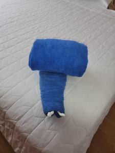 a blue towel is laying on a bed at Villa Perdomo in Las Palmas de Gran Canaria +23 photos