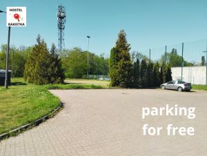 a parking lot with a car parked for free at Hostel Rakietka in Gdańsk