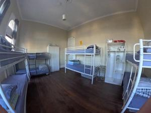 a room with several bunk beds in it at 1849 Backpackers at The London in Albany