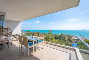 a dining room with a view of the ocean at Mountain and Sea view apartment in Nathon Bay