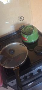 a pan sitting on top of a stove at Amir Guesthouse in Chon-Dzhargylchak