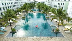 an overhead view of a large swimming pool in a hotel at MARINA SEASIDE BEACH BOUTIQUE Phu Quoc - Infinity Pools - PREMIUM SOLAR ENERGY in Phú Quốc