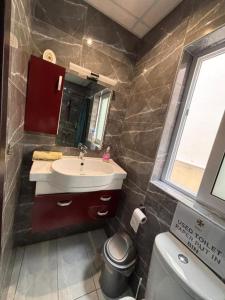 a bathroom with a sink and a toilet at Private Room and Own Kitchen Steps to Beach & Nightlife in Sliema