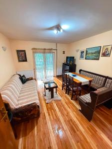 a living room with a couch and a table at Villa Vera in Vrnjačka Banja