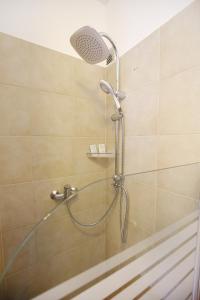 Kylpyhuone majoituspaikassa Allegro Exclusive Suites