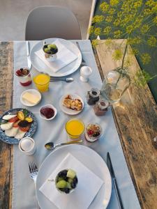 a table with plates of food on top of it at De Groene Bollenschuur in Hillegom
